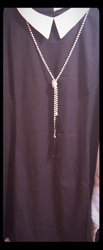 Black and white knee length dress.